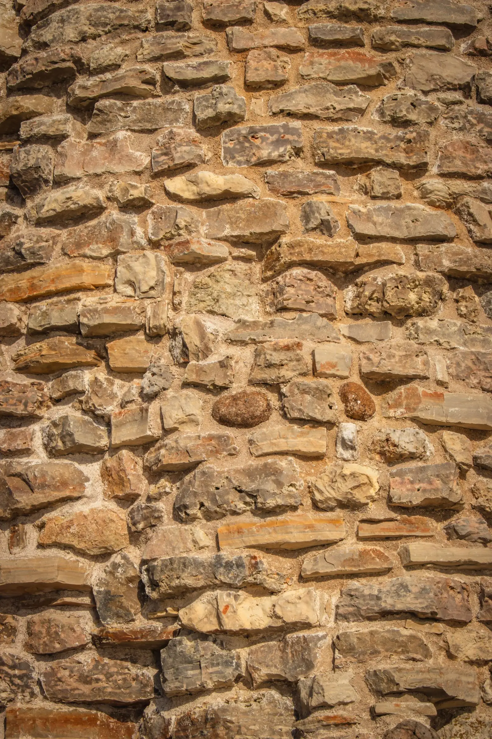 Close-up of fitted warm stone with tight, hand-pointed mortar joints